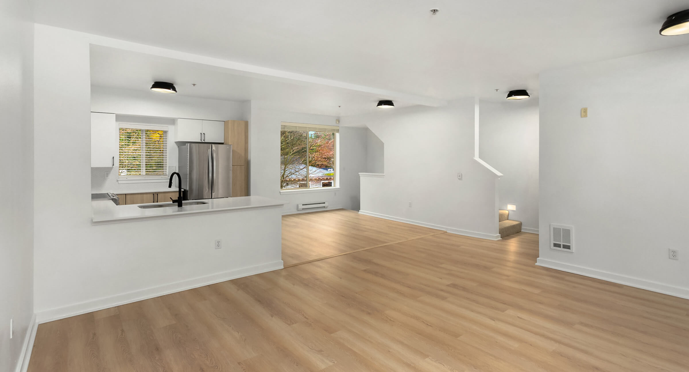 Bright living, dining, and kitchen.